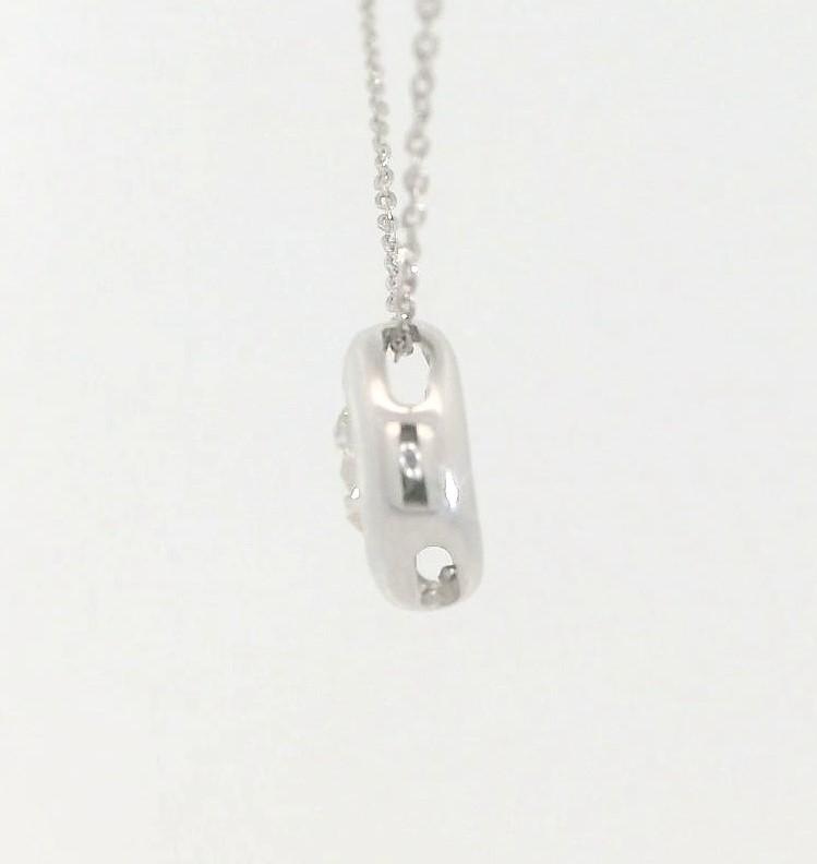 COLGANTE CHATON FUNDICION ORO BLANCO 7MM.BRILLANTE H-SI 1 . 0.25 CT.