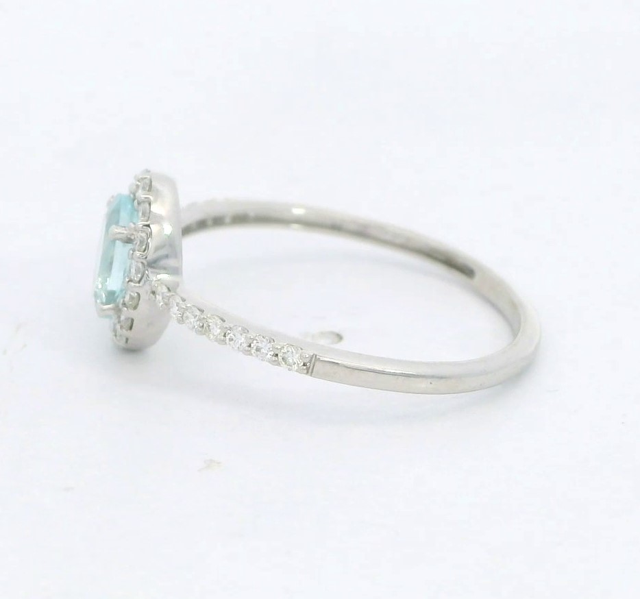 SORTIJA  BRILLANTES DI 20 RD VSI H 0.18 4 RD 0.023 DI 6 RD 0.043 1 AGUA MARINA 0.42 CT.0.22 CT TW