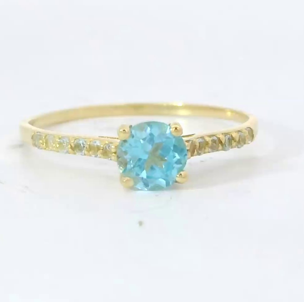 SOLITARIO GARRA PIEDRA TOPACIO AZUL NATURAL SEMI PRECIOSA5MM Y TOPACIOS  EN BRAZO