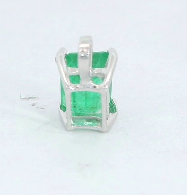 COLGANTE ESMERALDA NATURAL 7x5MM. ORO BLANCO