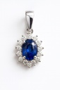 0.64 CT OVAL SAPPHIRE AND DIAMONDS PENDANT.QUALITY SI, COLOR H.0.15 CT TW