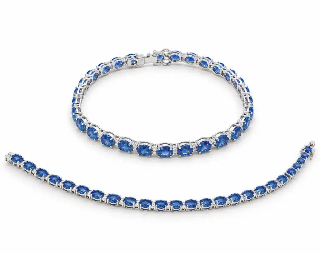 18CM WHITE GOLD RIVIERE BRACELET WITH DIAMONDS AND 10.62 CT TW SAPPHIRES.